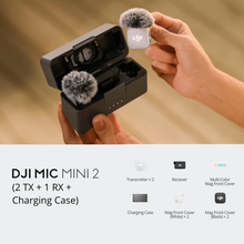 गैलरी व्यूवर में इमेज लोड करें, DJI Mic Mini 2 kit with 2 transmitters, receiver and charging case, held in hand with fluffy windscreens attached.