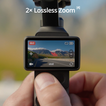 गैलरी व्यूवर में इमेज लोड करें, DJI Osmo Pocket 4 Creator Combo in-hand showing 2x lossless zoom and touchscreen