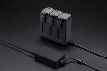 Load image into Gallery viewer, DJI Mavic 240W Power Adapter
With Three Drone Batteries Inserted And Connected To A Power Adapter.