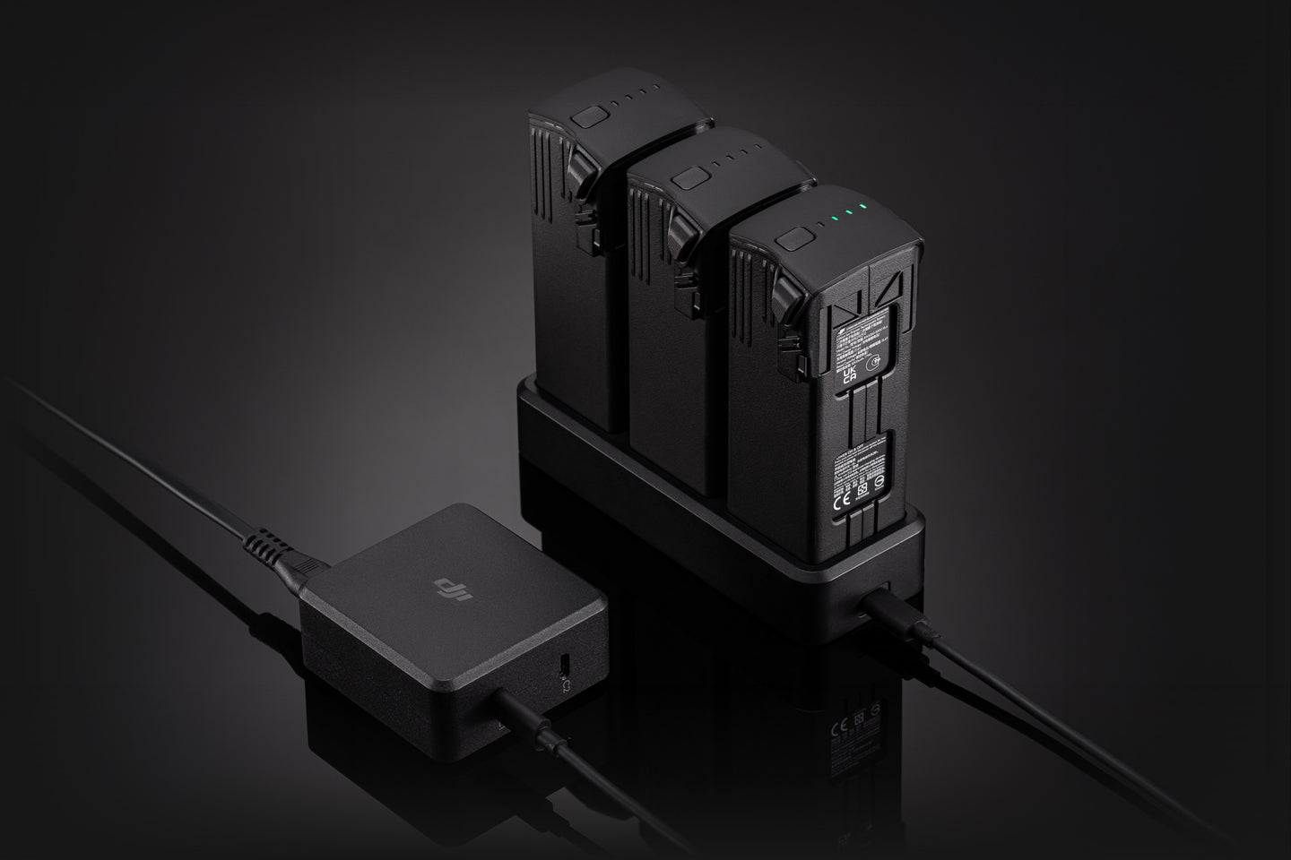 Three batteries charging With A DJI 100W USB-C Power Adapter