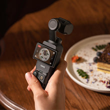 गैलरी व्यूवर में इमेज लोड करें, Hand holding DJI Osmo Pocket 3 filming a plated dessert in 4K30 recording mode
